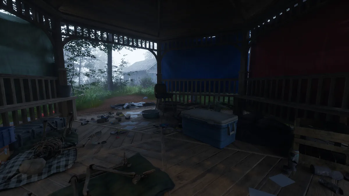 A player-built covered structure in Ardem with storage crates and salvaged materials